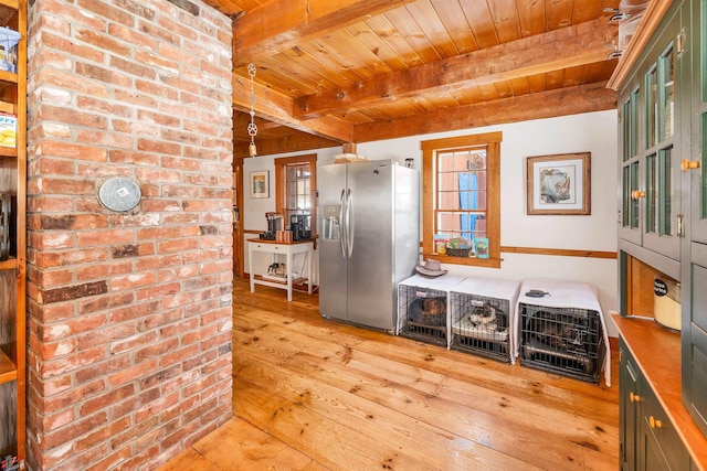 kitchen with wooden ceiling, wood finished floors, decorative light fixtures, stainless steel refrigerator with ice dispenser, and beam ceiling