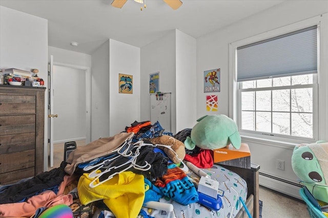 bedroom featuring a ceiling fan and baseboard heating