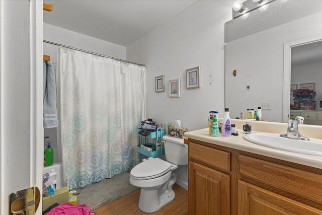 full bathroom with toilet, shower / tub combo, and vanity