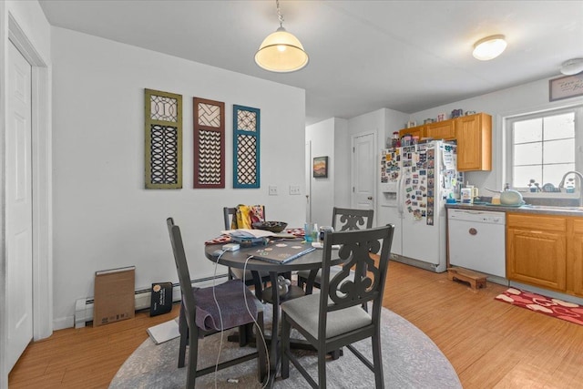 dining room featuring light wood-style floors