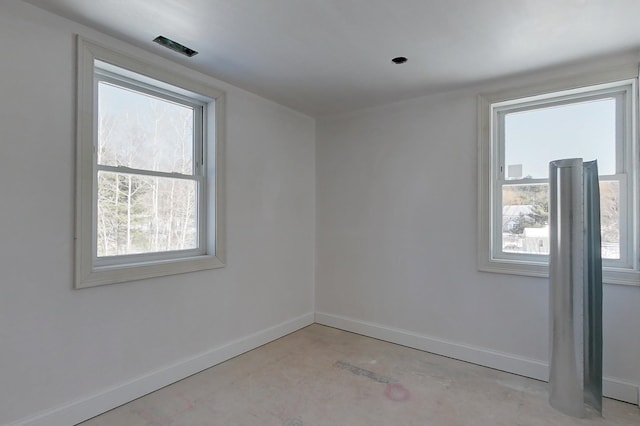 spare room featuring baseboards