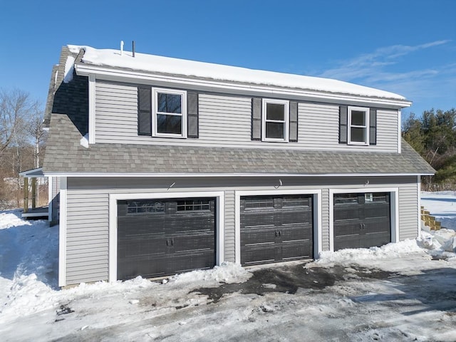 view of snow covered garage