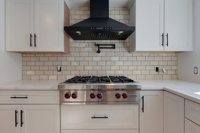 kitchen with white cabinetry, range hood, and stainless steel gas cooktop