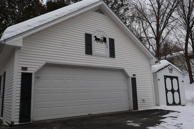 view of snow covered garage