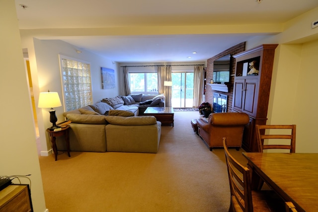 carpeted living room featuring a brick fireplace