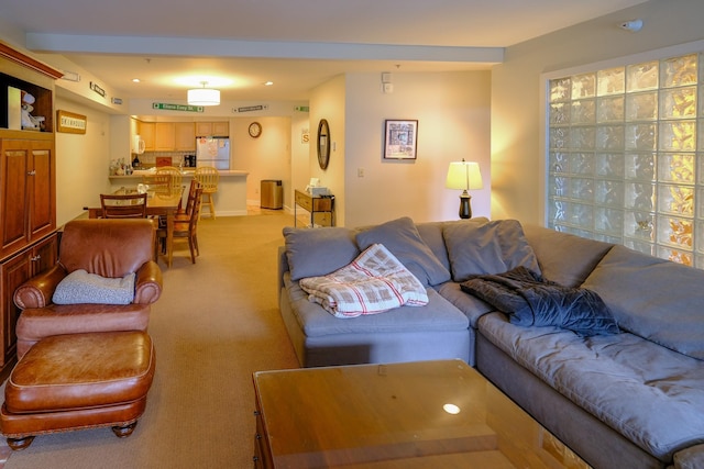 living room with recessed lighting and light colored carpet