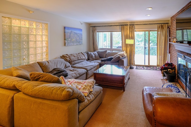 living area featuring a fireplace, carpet flooring, and recessed lighting