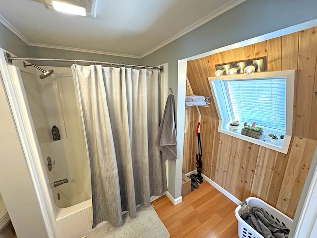 bathroom featuring crown molding, shower / bathtub combination with curtain, wood walls, wood finished floors, and baseboards