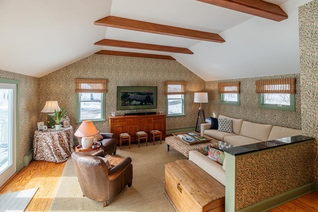 living area featuring vaulted ceiling with beams, wallpapered walls, a baseboard heating unit, and wood finished floors