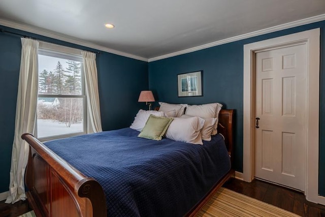 bedroom with ornamental molding and dark wood-style flooring