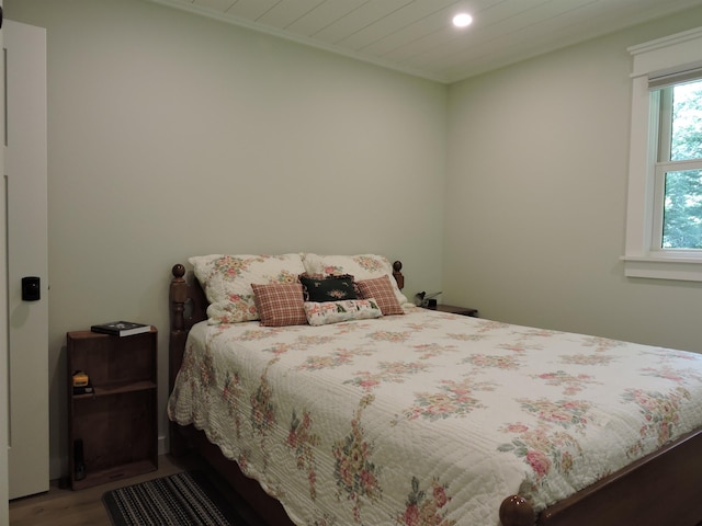 bedroom featuring wood finished floors and recessed lighting