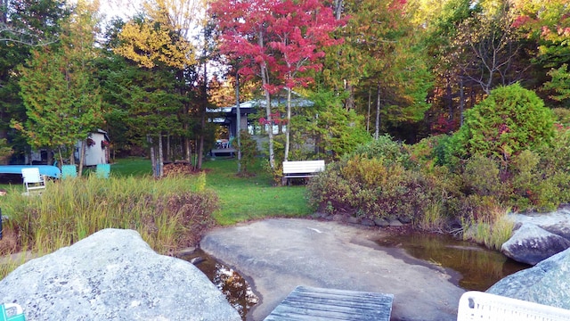 exterior space featuring an outbuilding and a shed