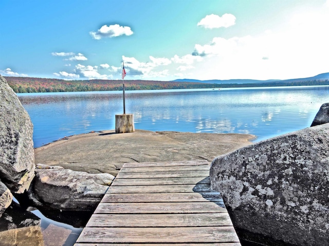 exterior space featuring a water and mountain view