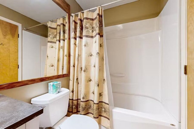 full bathroom featuring shower / bath combination with curtain, vanity, and toilet