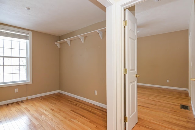 walk in closet featuring visible vents and light wood finished floors