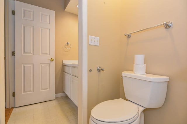 bathroom featuring toilet and vanity