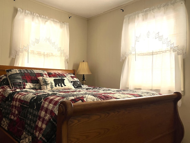 bedroom with ornamental molding