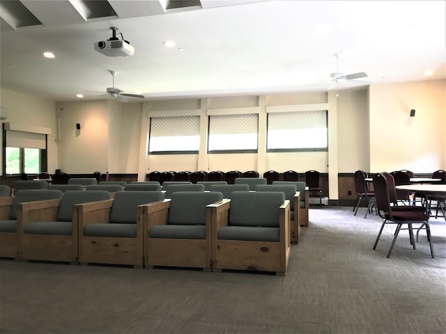 cinema with ceiling fan, dark colored carpet, and recessed lighting