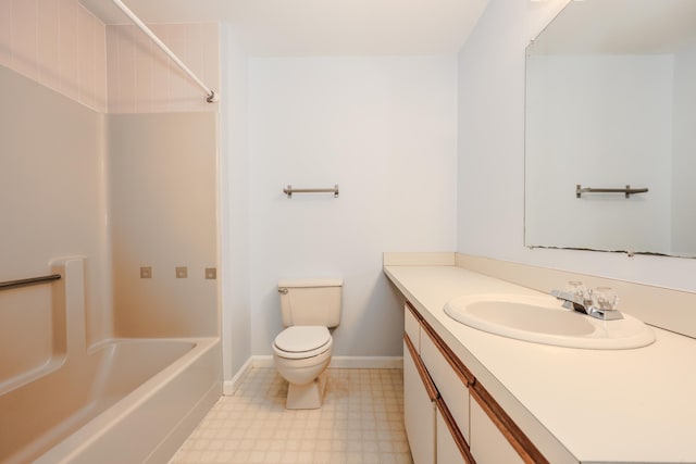 bathroom with baseboards, toilet, tile patterned floors, vanity, and shower / washtub combination