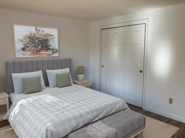 bedroom featuring a closet, baseboards, and dark wood-style flooring