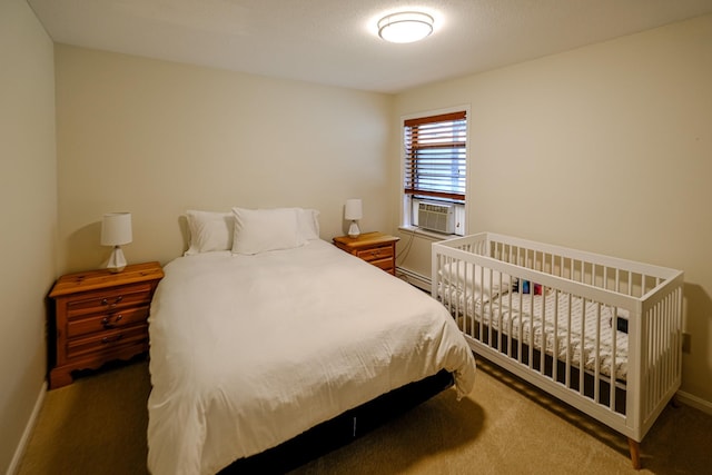 bedroom with a baseboard heating unit, dark carpet, cooling unit, and baseboards