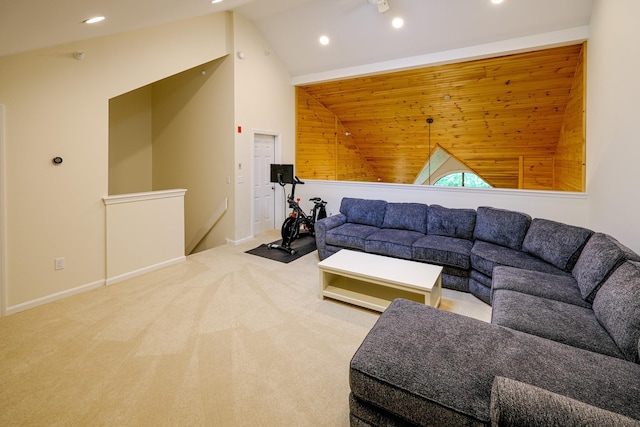 carpeted living area featuring lofted ceiling, baseboards, and recessed lighting