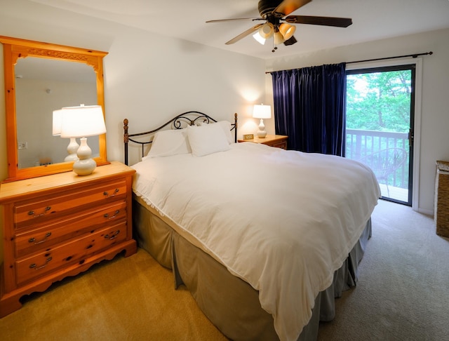 bedroom featuring access to exterior, a ceiling fan, and light colored carpet