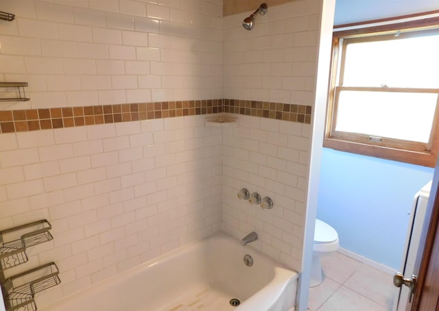 bathroom featuring tile patterned flooring, shower / tub combination, and toilet