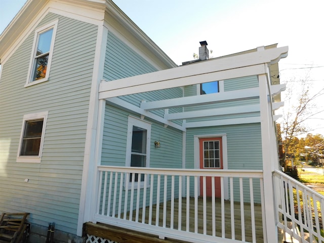 back of property featuring a chimney