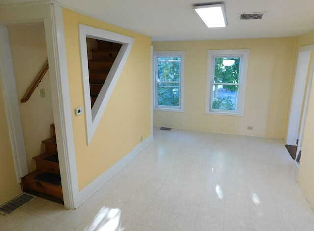 bonus room with baseboards, stairs, and visible vents