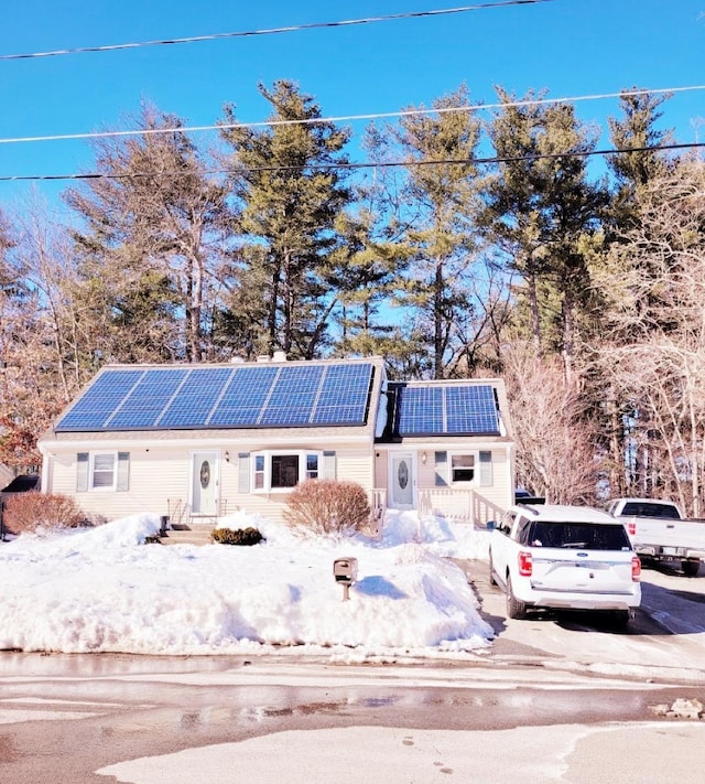 view of front of house with solar panels