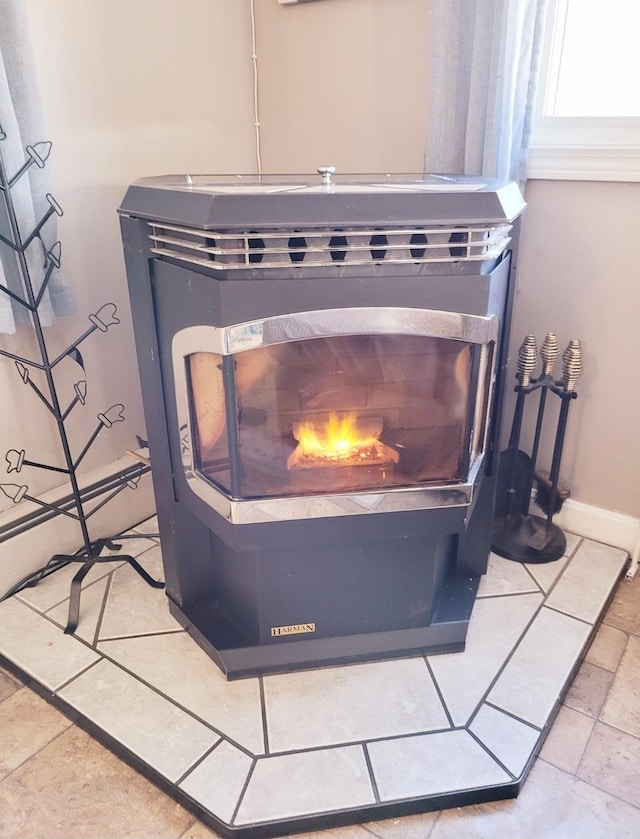 details with a lit fireplace and baseboards