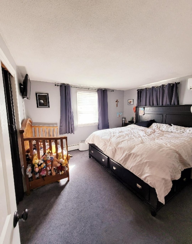 bedroom featuring carpet flooring and a textured ceiling