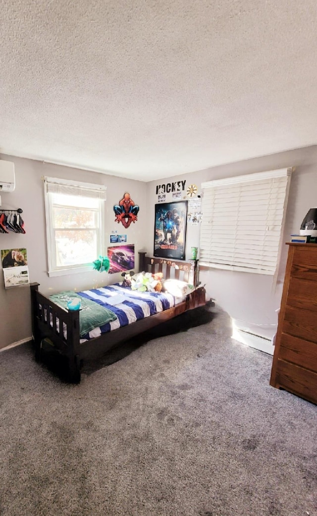 bedroom with a textured ceiling, a wall mounted AC, and carpet floors