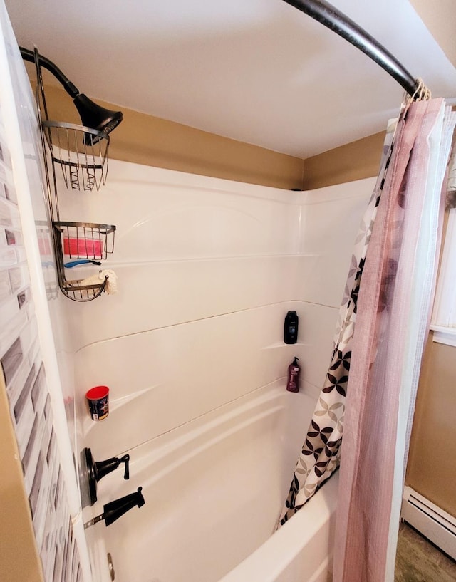 bathroom featuring shower / bath combination with curtain and a baseboard radiator