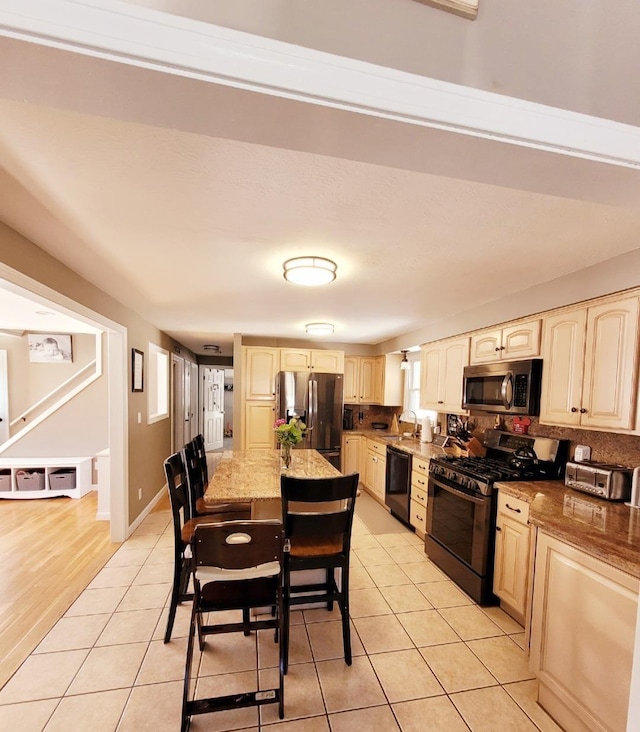 dining space with light tile patterned flooring and baseboards