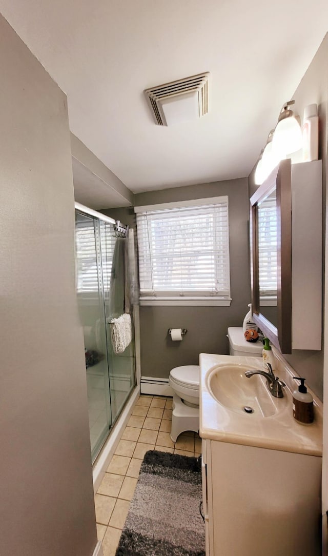 bathroom featuring visible vents, toilet, tile patterned floors, vanity, and a baseboard radiator