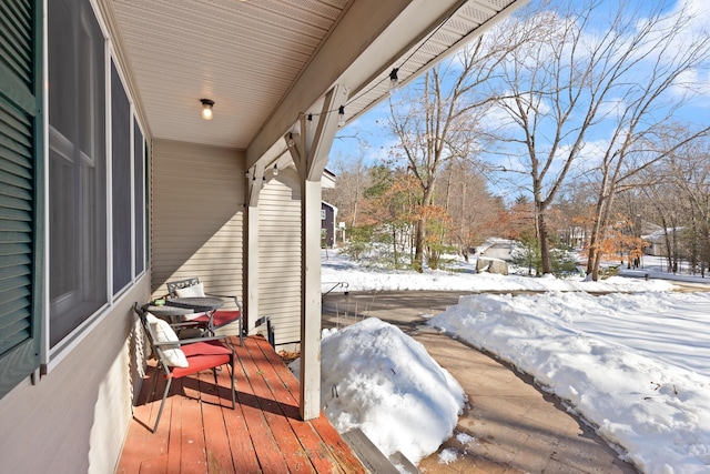 view of snow covered deck