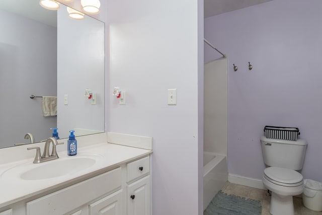 full bath featuring baseboards, toilet, tile patterned flooring, bathtub / shower combination, and vanity