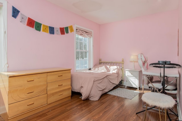 bedroom featuring wood finished floors