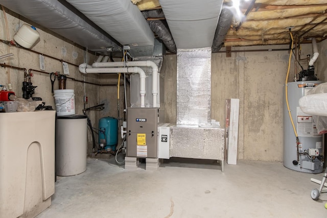 utility room featuring water heater