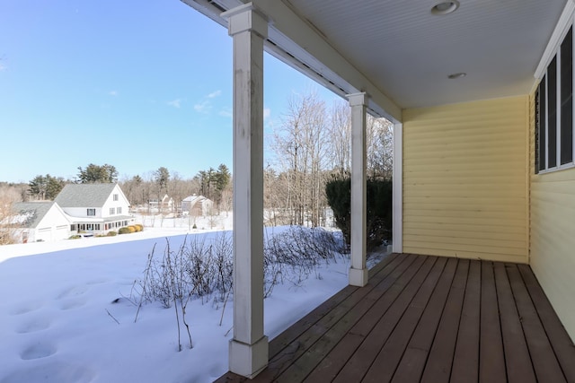 view of snow covered deck