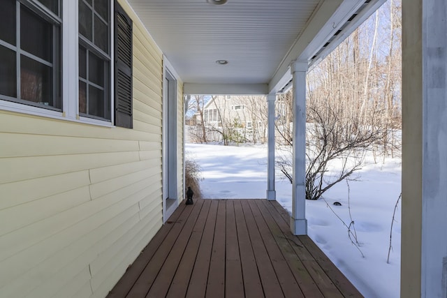 view of snow covered deck