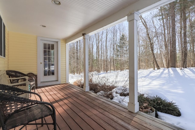 view of snow covered deck