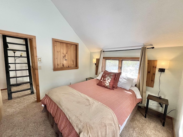 bedroom with lofted ceiling, a textured ceiling, and carpet flooring