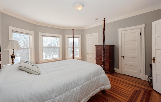 bedroom featuring baseboards, multiple windows, and crown molding