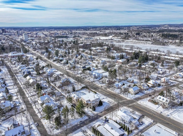 snowy aerial view featuring a residential view