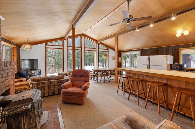 living area with lofted ceiling, wooden ceiling, carpet, and track lighting