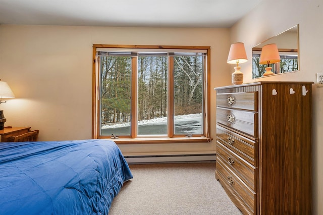 carpeted bedroom with baseboard heating