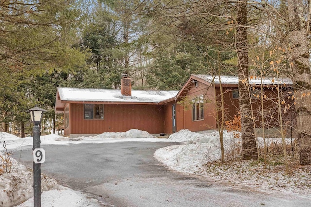 chalet / cabin featuring a chimney